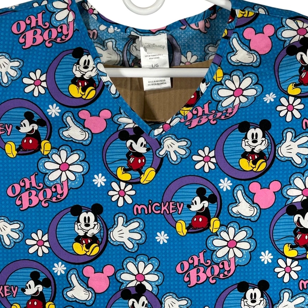 Disney Mickey Mouse Blue Oh Boy Daisy Print V-Neck Scrub Top
Size Large